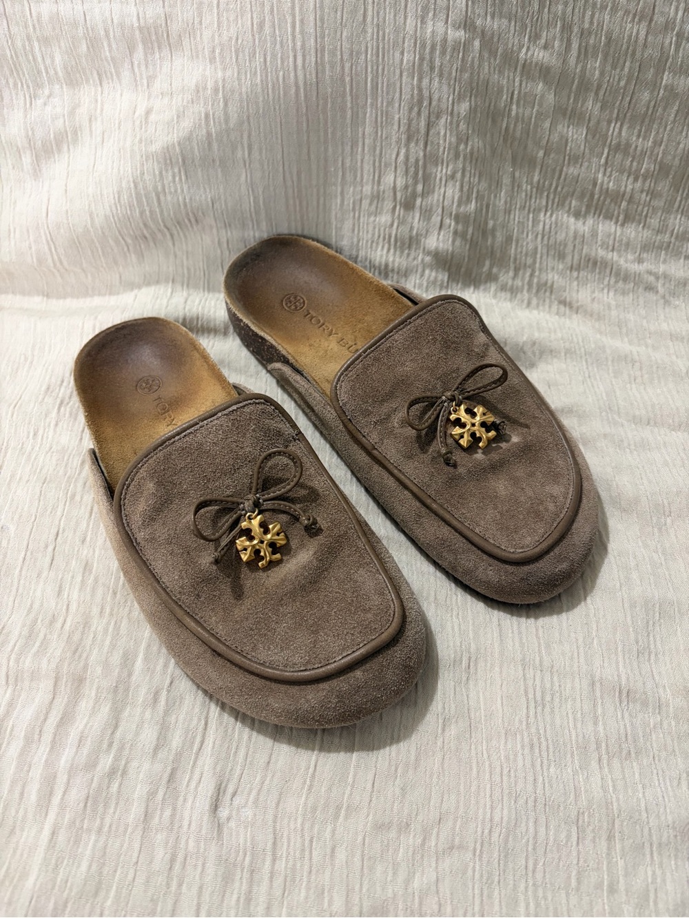 Tory Burch Taupe Suede Backless Mules with Gold Logo Charm